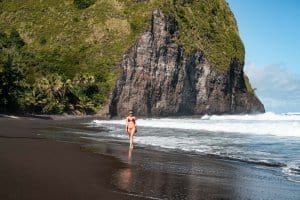 Sophie Clapton strolls along the black sand beach of the Waipio Valley.