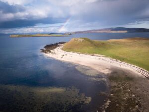 The only beach you will see during 10 days in Scotland is Coral beach, seen here with a rainbow.