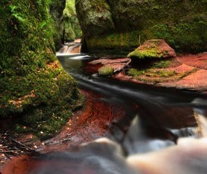 Blood red waters run through the Devils Pulpit at Finnich Glen.