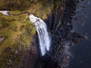 One of the stops on the best Scotland road trip itinerary is Kilt Rock, seen here looking down at Mealt Falls from above.