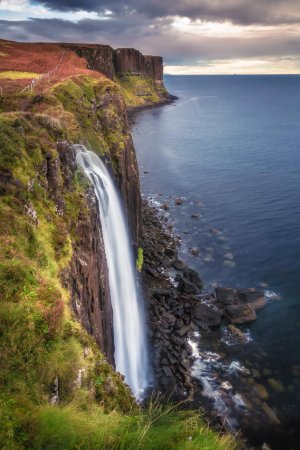 The view of Mealt Falls at Kilt Rock during golden hour on the Isle of Skye.