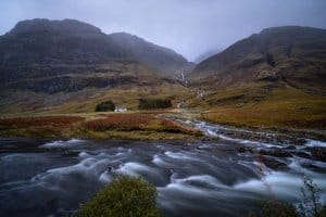 The old house on Loch Achtriochtan gives scale to the towering Highlands.
