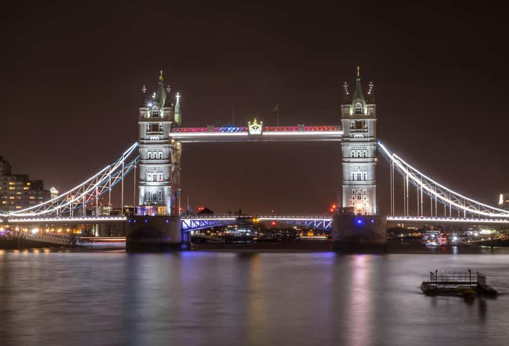 The iconic Tower Bridge lit up at night.