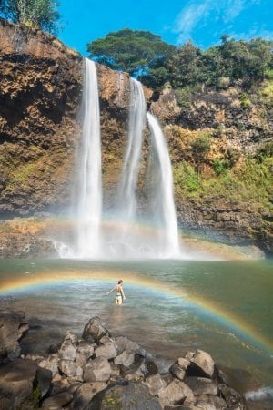 Standing below a rainbow at Wailua Falls in Kauai.