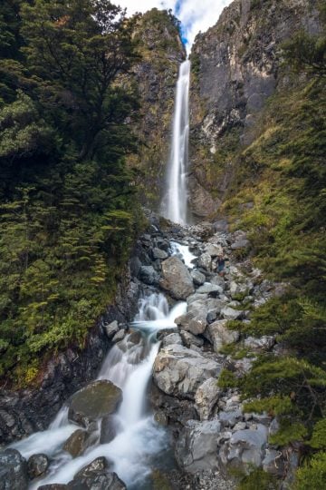 The massive Devil's Punchbowl Falls can be seen from the road, or visited up close, on your final day in New Zealand.