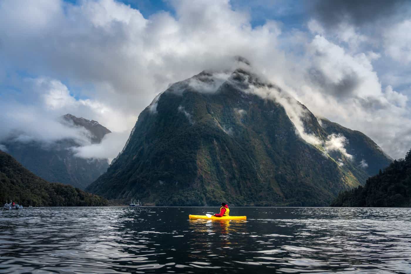 A kayaker during a Doubtful Sound overnight cruise - a must for those with the time and budget.