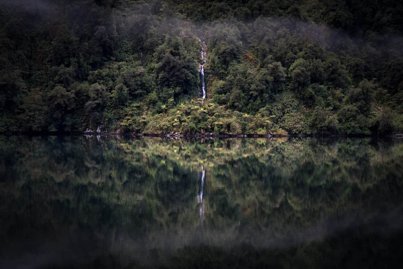 Unbelievably calm waters grace our morning at Doubtful Sound.
