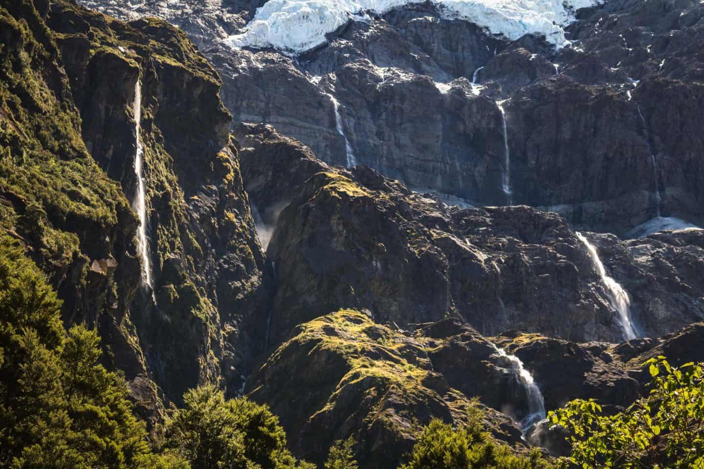 Waterfalls stream down the sides of the Rob Roy Glacier near Wanaka.