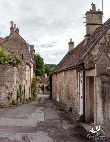 Narrow streets aligned with honey hued homes in Freshford Village.