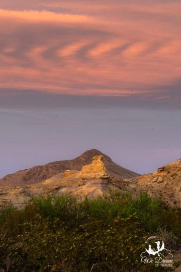 Interesting clouds over a desert hoodoo from Exhibit Ridge in Big Bend National Park.