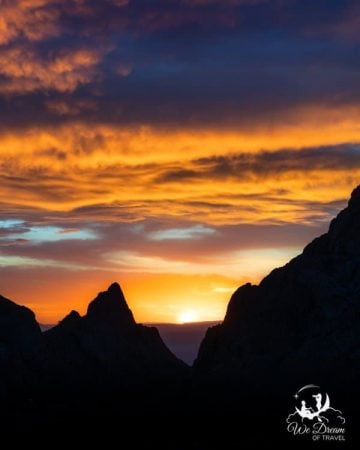 A skyfire sunset through "The Window" in the Chisos Basin of Big Bend National Park.
