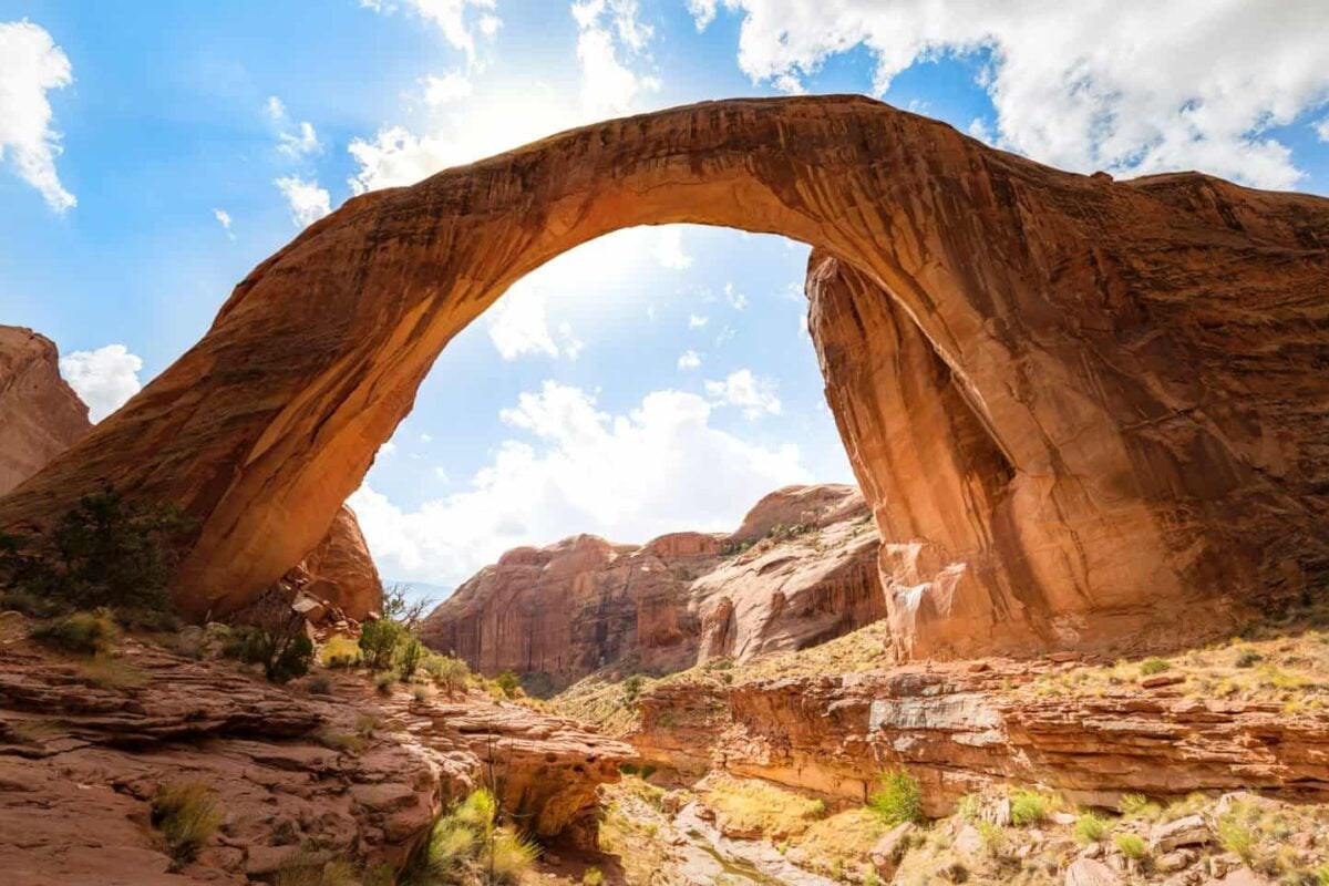 Blue skies behind Rainbow Bridge National Monument on Lake Powell on a tour of Page AZ