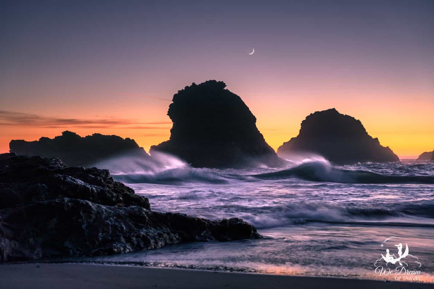 Twilight on the Oregon Coast with a crescent moon and fading color.
