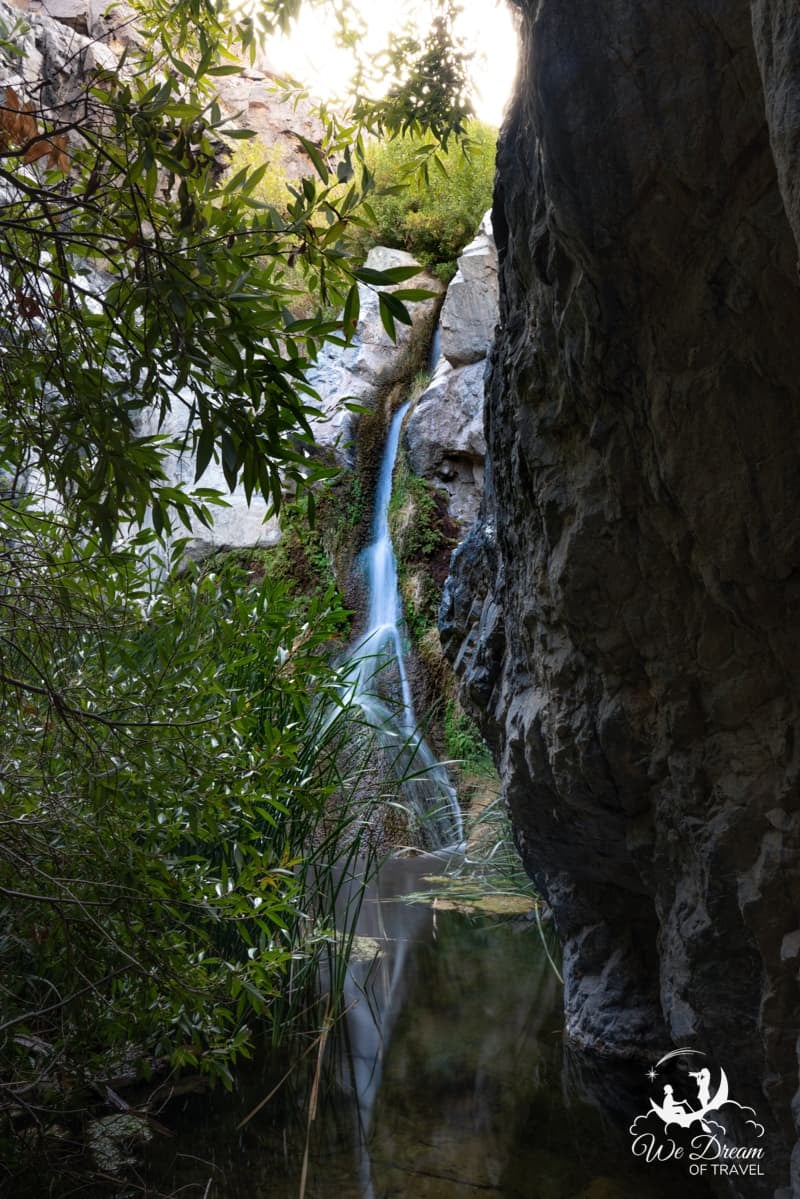 Death Valley's only waterfall, Darwin Falls, is seen in this vertical format landscape photograph.