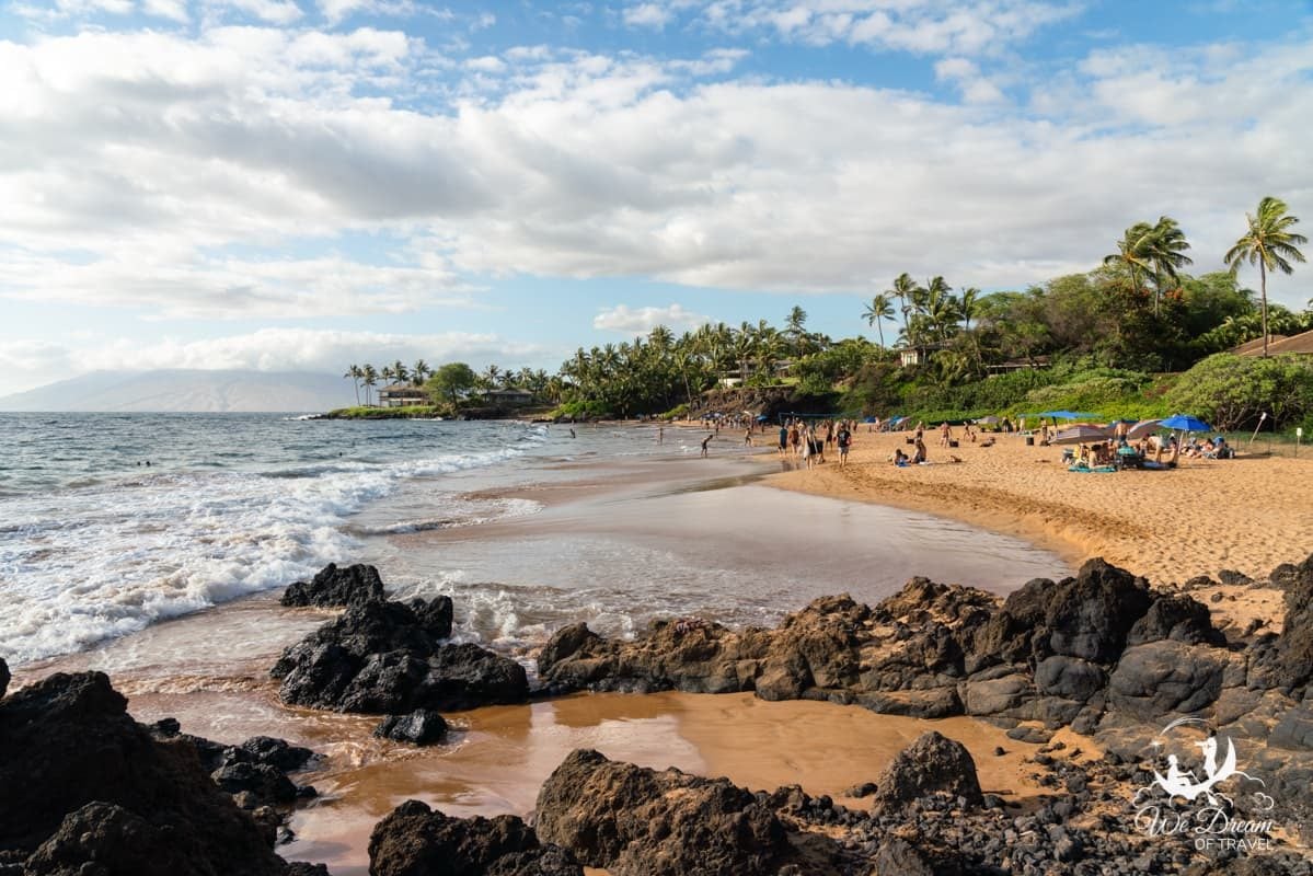 Lava rock lines the shoreline of Changs Beach in Maui
