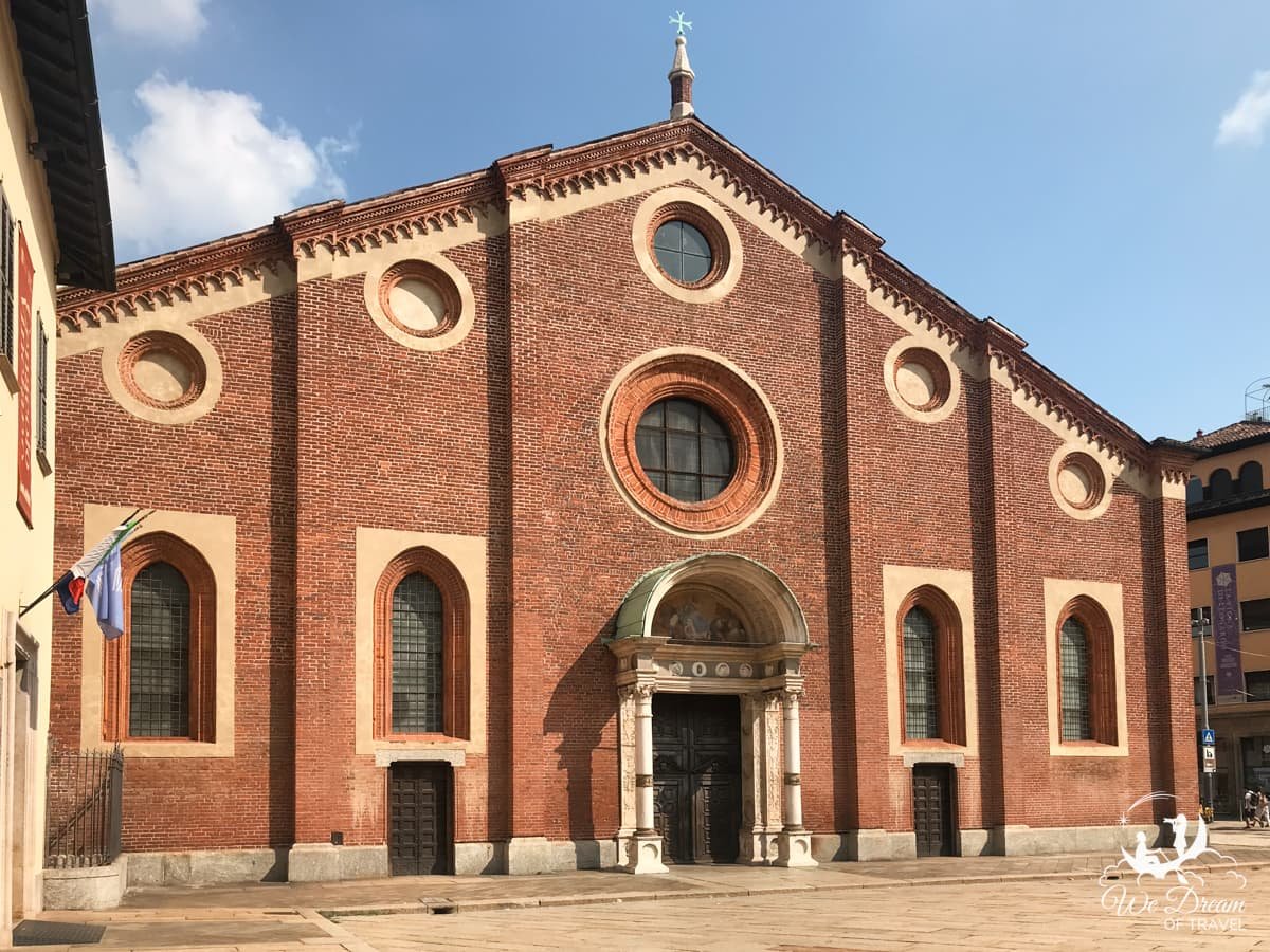 Red brick exterior of Santa Maria delle Grazie, the only UNESCO World Heritage site in Milan