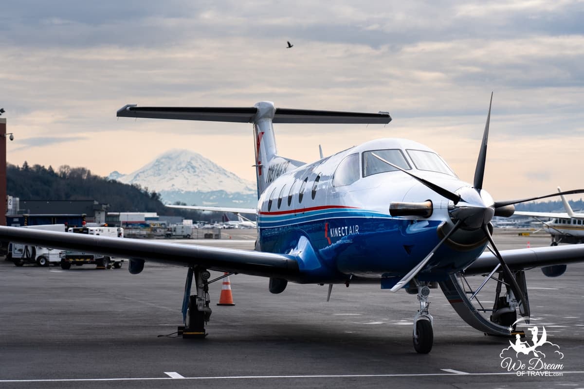 KinectAir aircraft awaiting takeoff from a small airfield near Seattle with Mt Rainer in the background